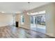Bright dining room with hardwood floors and sliding glass doors at 2024 Embassy Ct # 49, Charlotte, NC 28213
