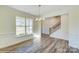 Spacious dining room with hardwood floors and staircase view at 2024 Embassy Ct # 49, Charlotte, NC 28213