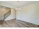 Formal dining room with hardwood floors and wainscoting at 2024 Embassy Ct # 49, Charlotte, NC 28213