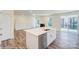 Modern kitchen with island, white cabinets, and stainless steel appliances at 2024 Embassy Ct # 49, Charlotte, NC 28213