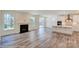 Open kitchen with white cabinets, island, and stainless steel appliances at 2024 Embassy Ct # 49, Charlotte, NC 28213