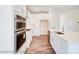 Modern kitchen with white cabinets, stainless steel appliances, and an island at 2024 Embassy Ct # 49, Charlotte, NC 28213