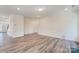 Spacious living room with hardwood floors and a fireplace at 2024 Embassy Ct # 49, Charlotte, NC 28213