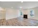 Bright living room with hardwood floors and fireplace at 2024 Embassy Ct # 49, Charlotte, NC 28213