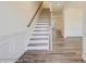 Modern staircase with white risers and wooden handrail at 2024 Embassy Ct # 49, Charlotte, NC 28213