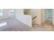 Upper floor hallway with carpeted floors and staircase at 2024 Embassy Ct # 49, Charlotte, NC 28213