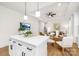 Modern kitchen island with white cabinets and a view into the dining area at 204-1 Starview Ln, Dallas, NC 28034