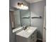 Bathroom with white vanity and marble countertop at 213 Wood Duck Ct, Gastonia, NC 28056