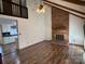 Spacious living room with brick fireplace and hardwood floors at 213 Wood Duck Ct, Gastonia, NC 28056