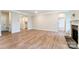 Large living room with hardwood floors and a stone fireplace at 3006 Cedar Falls Dr # 12, Waxhaw, NC 28173