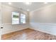 Home office with wainscoting, wood floors and two windows at 3006 Cedar Falls Dr # 12, Waxhaw, NC 28173