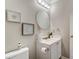 Clean bathroom with white vanity and updated fixtures at 3030 Talledaga Sw Ln, Concord, NC 28025