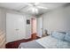 Bedroom with hardwood floors and double door closet at 3030 Talledaga Sw Ln, Concord, NC 28025