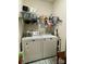 Well-lit laundry room, complete with washer, dryer, and ample storage at 3100 Glacier Ct, Gastonia, NC 28056