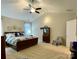 Large main bedroom with plush carpet, ceiling fan, and ample natural light at 3100 Glacier Ct, Gastonia, NC 28056
