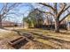 Large backyard with mature trees and garden at 315 Hillandale Ne St, Concord, NC 28025