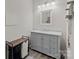 Modern bathroom with gray vanity, marble countertop, and shower at 315 Hillandale Ne St, Concord, NC 28025