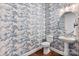 Powder room with stylish wallpaper and pedestal sink at 332 Basil Dr, Indian Trail, NC 28079