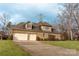 Two-car garage with driveway and backyard view at 4518 Burrenfort Dr, Denver, NC 28037