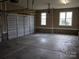 Spacious two-car garage with concrete floor at 4518 Burrenfort Dr, Denver, NC 28037