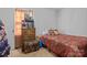 Small bedroom with a double bed and dresser at 4601 Coronado Dr # G, Charlotte, NC 28212