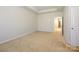 Bright bedroom with carpeted floor and access to hallway at 7542 Waverly Walk Ave # 7542, Charlotte, NC 28277