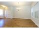 Bright dining room with hardwood floors and chandelier at 7542 Waverly Walk Ave # 7542, Charlotte, NC 28277