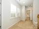 Upstairs hallway with carpet and doors to bedrooms and bathroom at 7542 Waverly Walk Ave # 7542, Charlotte, NC 28277