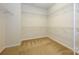 Large walk-in closet with wire shelving and carpeted floor at 7542 Waverly Walk Ave # 7542, Charlotte, NC 28277