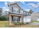 Two-story house with gray siding, brick accents, and a two-car garage at 889 Brunswick Dr, Rock Hill, SC 29730