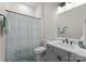 Simple bathroom with shower, gray vanity, and white sink at 997 Skyland S Dr, Mount Pleasant, NC 28124