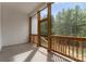 Screened porch overlooking wooded backyard at 997 Skyland S Dr, Mount Pleasant, NC 28124