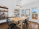 Farmhouse-style dining area with wood table, metal chairs, and built-in shelving at 116 Cedar Branch Ct, Mooresville, NC 28117