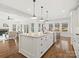 Open concept kitchen boasts a large island and stainless steel appliances at 116 Cedar Branch Ct, Mooresville, NC 28117