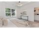 Spacious bedroom with window and decorative console table at 1506 E Cole St, Gastonia, NC 28054