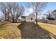 House backyard with grass, trees, and a wooden fence at 1716 Maxton Ave, Gastonia, NC 28052