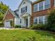 Two-story house with a side-entry garage and neatly landscaped front yard at 2015 Mallard Pine Ct, Charlotte, NC 28262