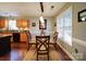 Bright dining area with glass top table and four chairs at 537 Scarlet Leaf Ln, Oakboro, NC 28129