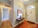 Bright entryway with hardwood floors and a charming console table at 537 Scarlet Leaf Ln, Oakboro, NC 28129