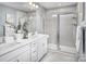 Elegant bathroom with double vanity and a large walk-in shower at 7224 Hodges Meadow Ln, Charlotte, NC 28213