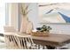 Dining area with wooden table, white chairs, and decorative centerpiece at 7224 Hodges Meadow Ln, Charlotte, NC 28213