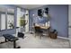 Home gym with stationary bike, weights, and mirrors at 7224 Hodges Meadow Ln, Charlotte, NC 28213