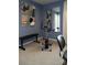 Home gym with stationary bike and weight bench at 7224 Hodges Meadow Ln, Charlotte, NC 28213