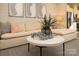 Living room with beige sectional sofa, coffee table, and accent pillows at 7224 Hodges Meadow Ln, Charlotte, NC 28213