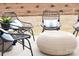 Relaxing patio furniture set with wicker chairs and coffee table at 7224 Hodges Meadow Ln, Charlotte, NC 28213