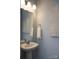 Modern powder room with pedestal sink and decorative wall art at 7224 Hodges Meadow Ln, Charlotte, NC 28213