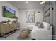 Relaxing recreation room with sectional sofa and large TV at 7224 Hodges Meadow Ln, Charlotte, NC 28213