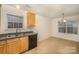 Kitchen with light wood cabinets, tile floor, and a breakfast nook at 10609 Turkey Point Dr, Charlotte, NC 28214