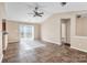 Spacious living room with tile floors and access to other rooms at 13502 Tartarian Ct, Charlotte, NC 28215