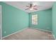 Spacious bedroom with mint green walls and ceiling fan at 14752 Lions Paw St, Charlotte, NC 28273